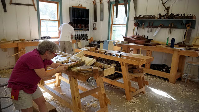 Students working at a Moravian Workbench at the introduction to hand tool woodworking class