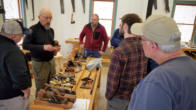 Bill Anderson teaching students about handplanes in a woodworking class