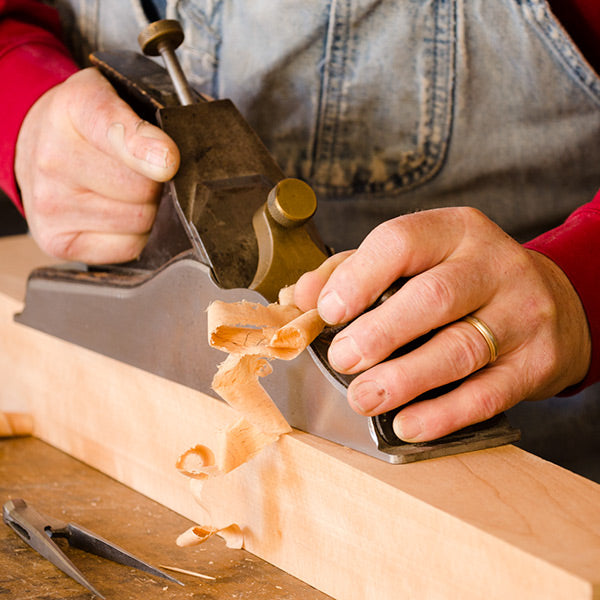 Bill Anderson using a Scottish infill hand plane in a woodworking class