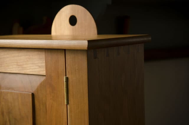 hanging hole of a Cherry shaker wall cupboard