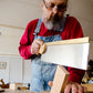Bill Anderson using a tenon saw to cut a wooden wedge for a wooden hand plane