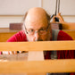 Bill Anderson using winding sticks to ensure the flatness of his new wooden hand plane