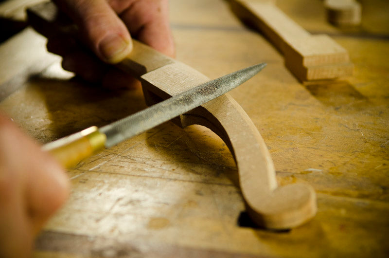 Bill Anderson using a rasp to shape the handle of a Howarth Bowsaw