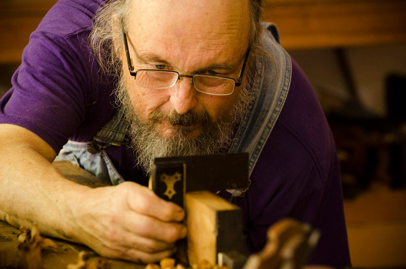 Bill Anderson repairing a rabbet plane with a try square and hand plane