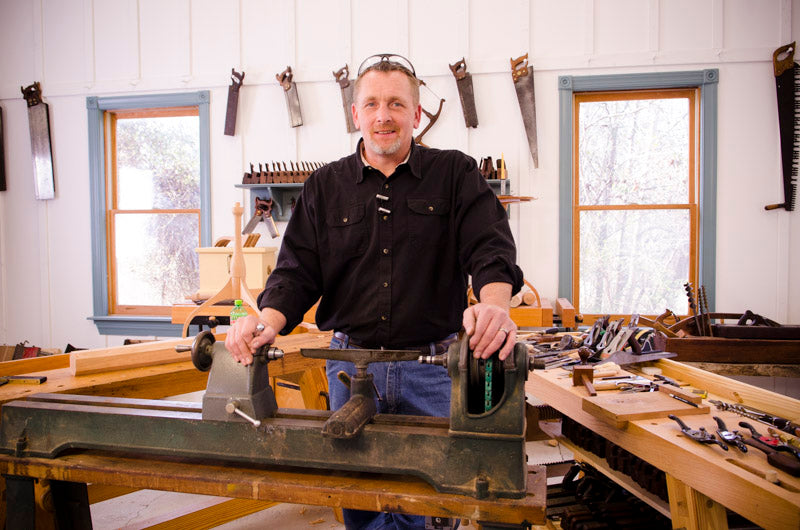 Will Myers using a lathe while building a Hancock shaker candle stand