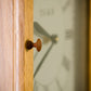 Turned knob on the Isaac Youngs Shaker Wall Clock 