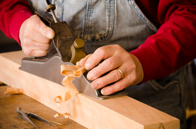 Bill Anderson using a Scottish infil plane to flatten the bottom of a wooden hand plane
