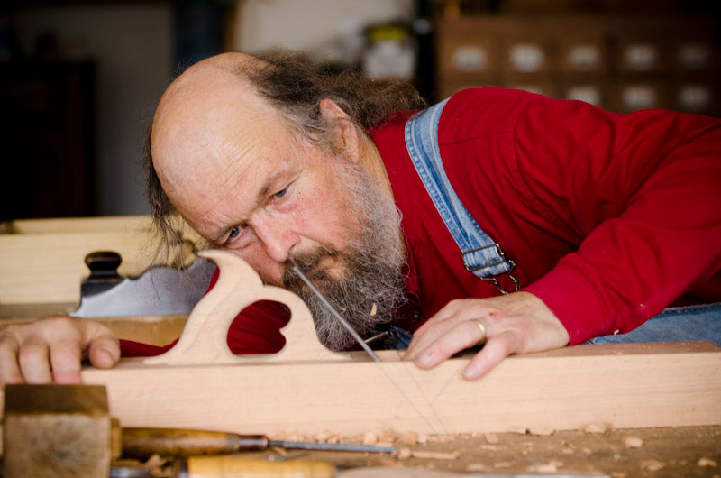 Bill Anderson inspecting the new wooden jointer plane that he made