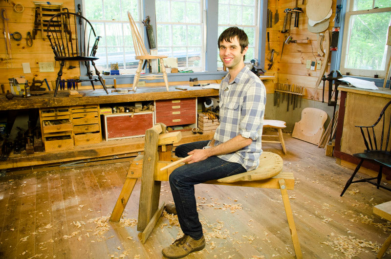 Elia Bizzarri in his workshop building a windsor chair on a shaving horse