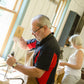 Man chopping a mortise and tenon joint using a mortise chisel and joiners mallet at a hand tool woodworking class