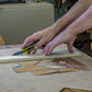 Dave Heller cutting wood veneer