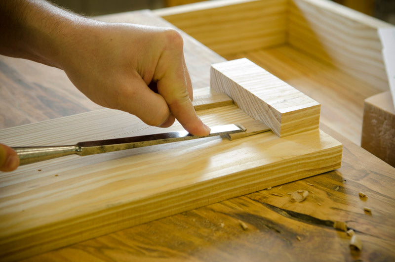 A Woodworking Student Using A Chisel At Joshua Farnsworth'S Wood And Shop Woodworking School