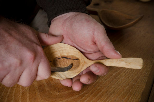 Spoon carving with a hook knife